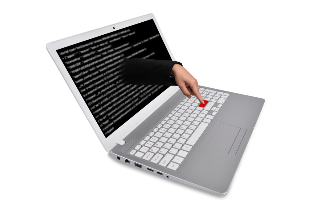Concept illustration of an attack. Finger on keyboard.